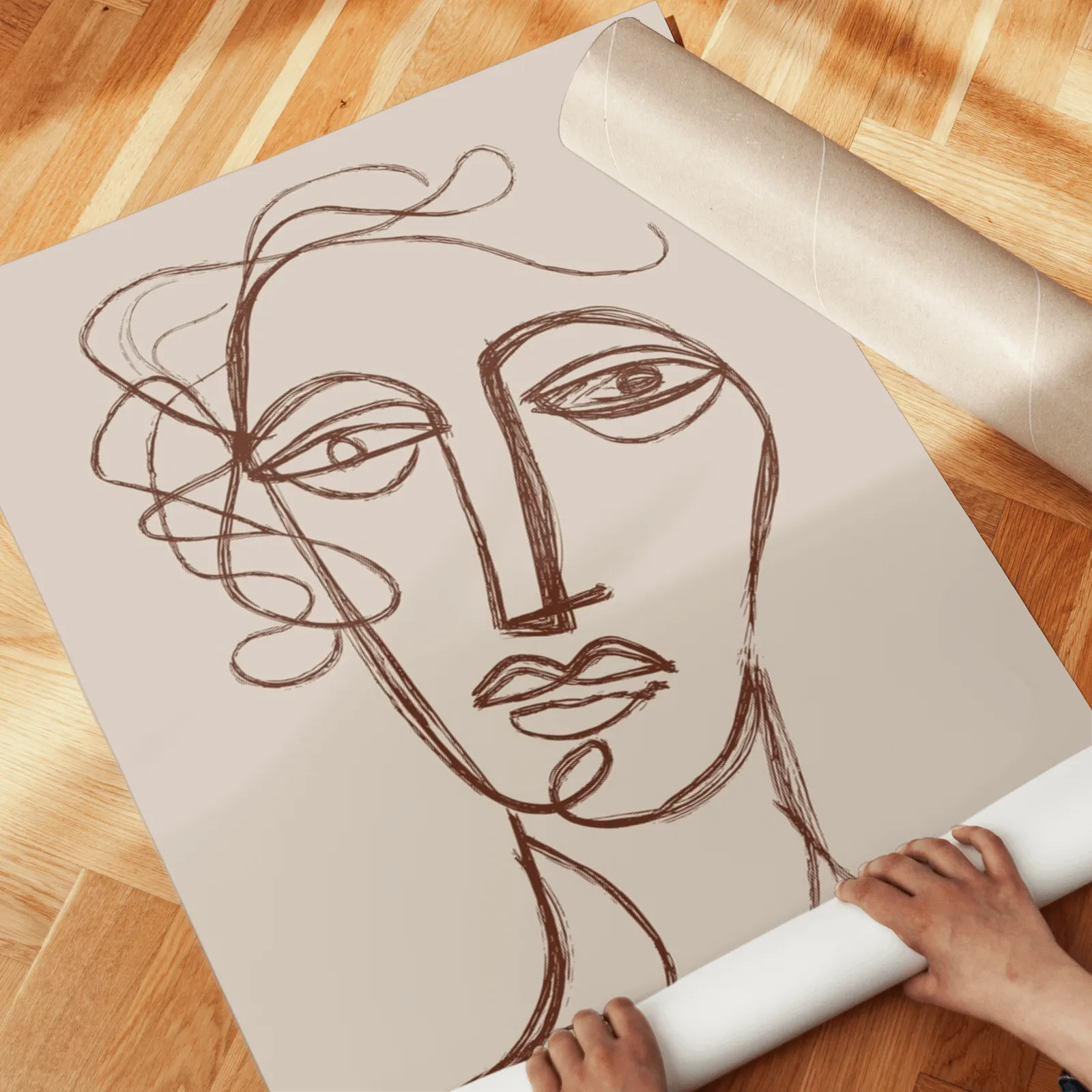 terracotta and beige abstract face art set of two, unrolled across a herringbone parquet floor by hand