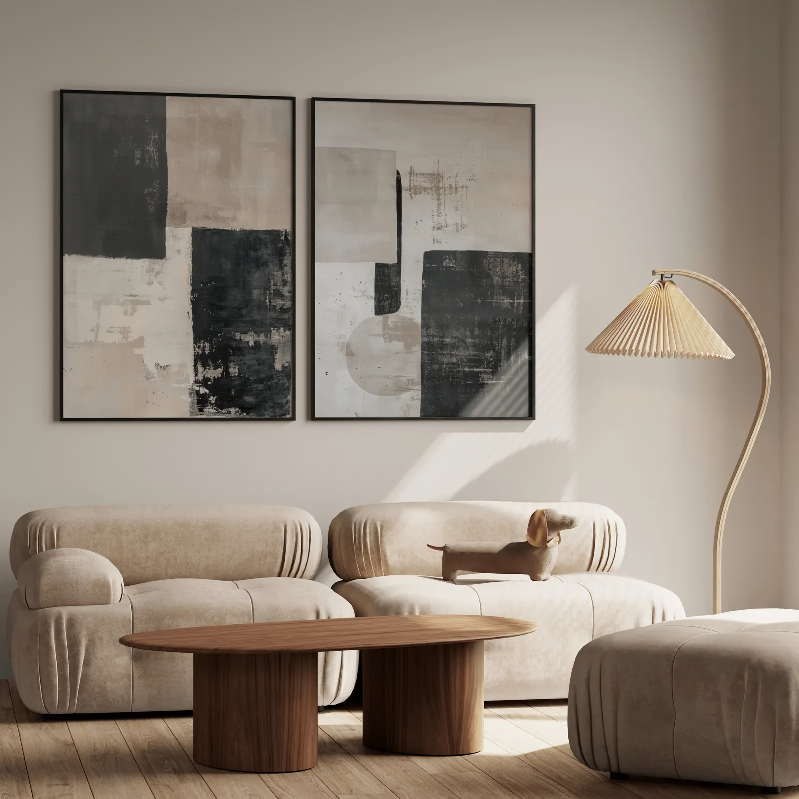 beige and black abstract wall art set of 2, above a plush beige sofa with a pleated lamp nearby