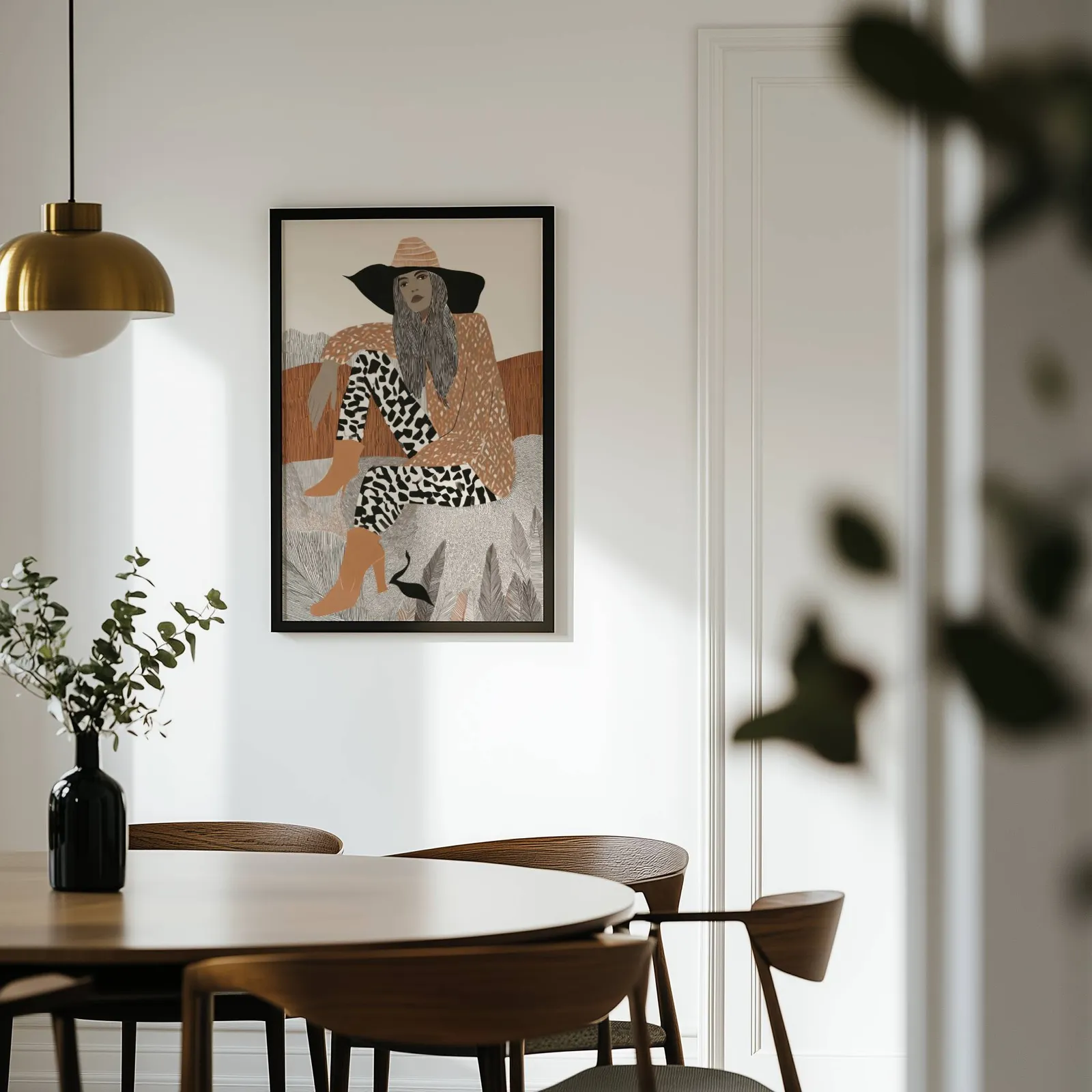 terracotta boho woman portrait wall art, on a white wall above a round wooden dining table