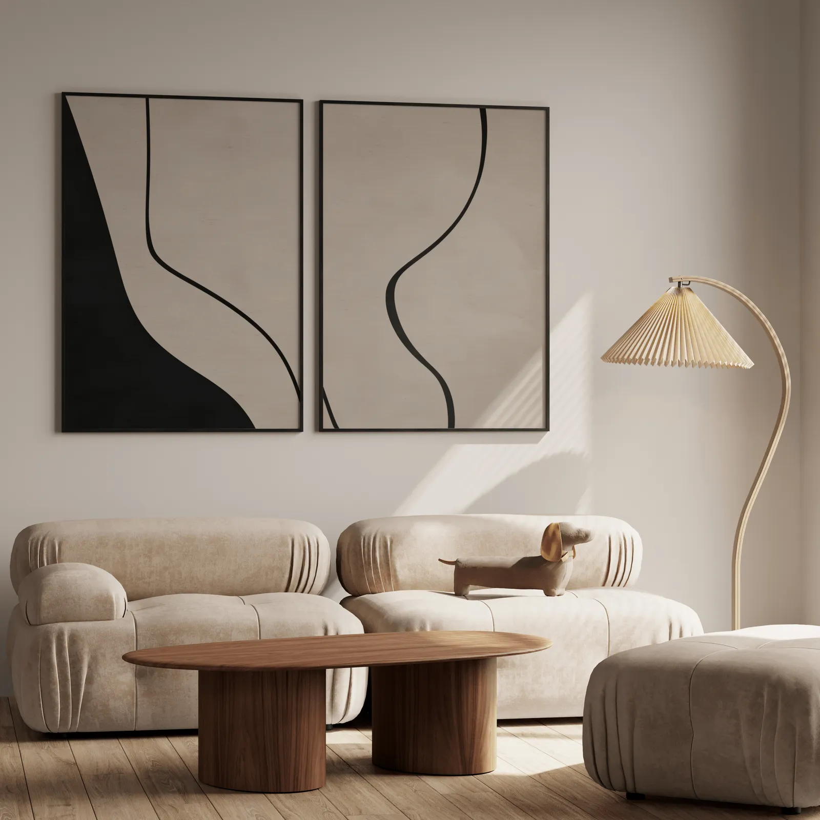beige abstract minimalist wall art set of two, above a plush beige sofa with a pleated lamp nearby